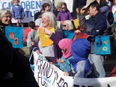 Mother Out Front rally at the statehouse against climate change