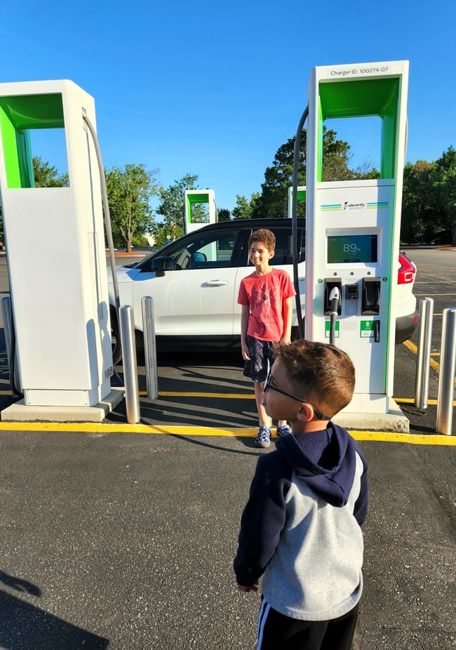 EV Ambassador Nicole Cooper kids at Electrify America charging station Volvo XC40 for blog