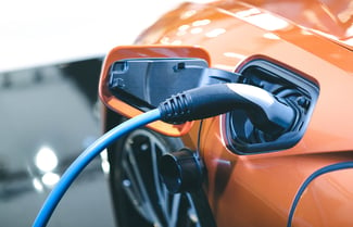 Orange-electric-car-charging-1992x1200px
