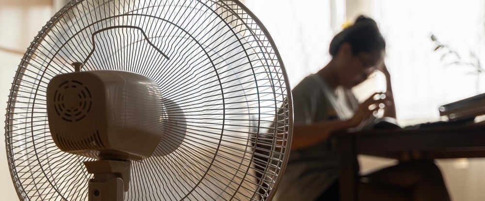 person in front of fan - blog image